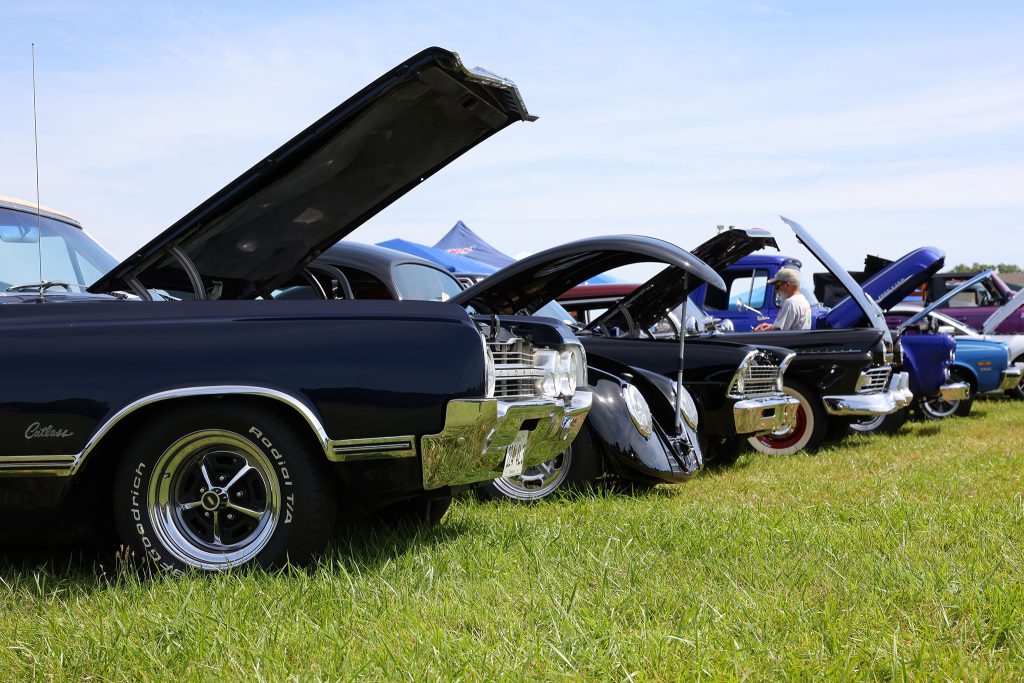 Classic cars on display at a Chesapeake Custom Carriage car show