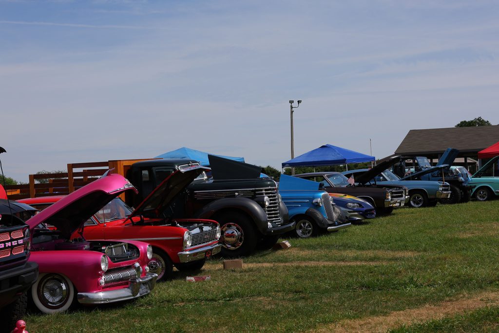 Classic cars lined up on the show field