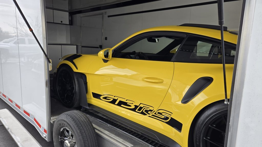 Yellow Porsche GT3 RS loaded for transport