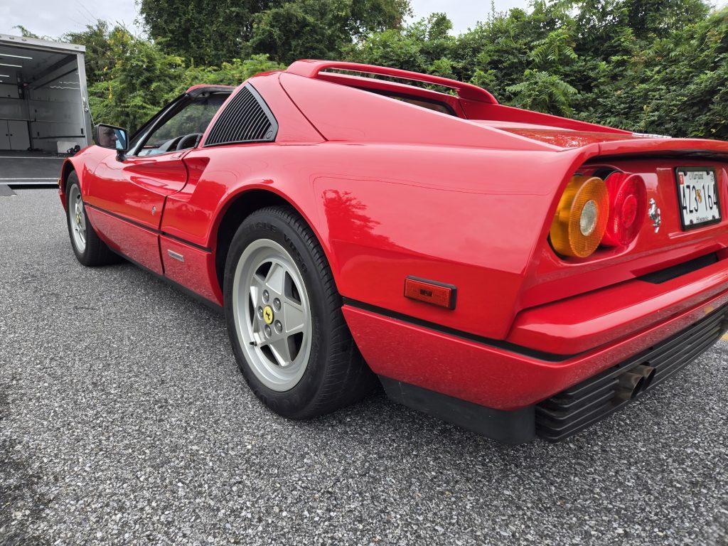 Red Ferrari 328 secured for delivery